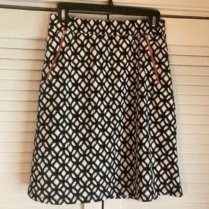 LIKE NEW! Black and white patterned skirt with red zipper accents